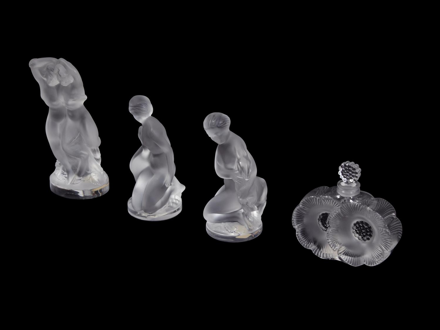 A Collection of Seven Lalique Glass Articles Height of tallest figure 5 1/2 inches.