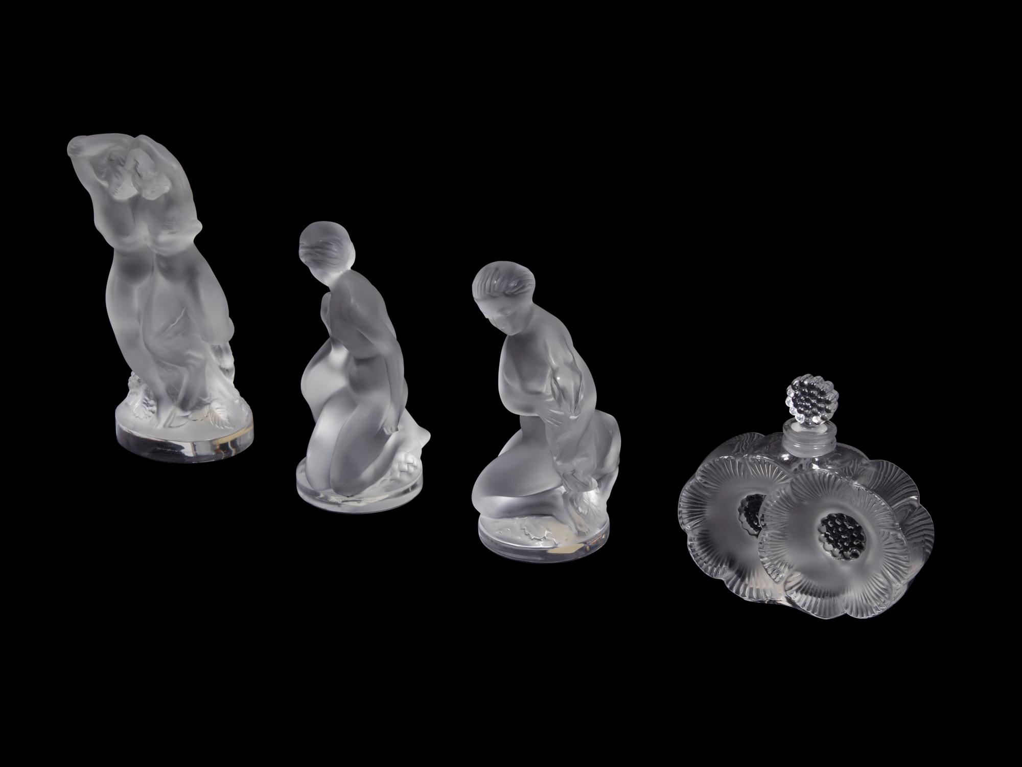 A Collection of Seven Lalique Glass Articles Height of tallest figure 5 1/2 inches.