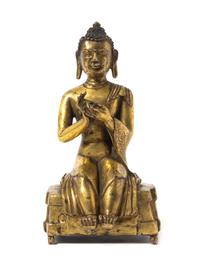 A Tibetan Gilt Bronze Figure of Buddha 17TH/18TH CENTURY Height 6 3/8 inches. — 17TH/18TH CENTURY