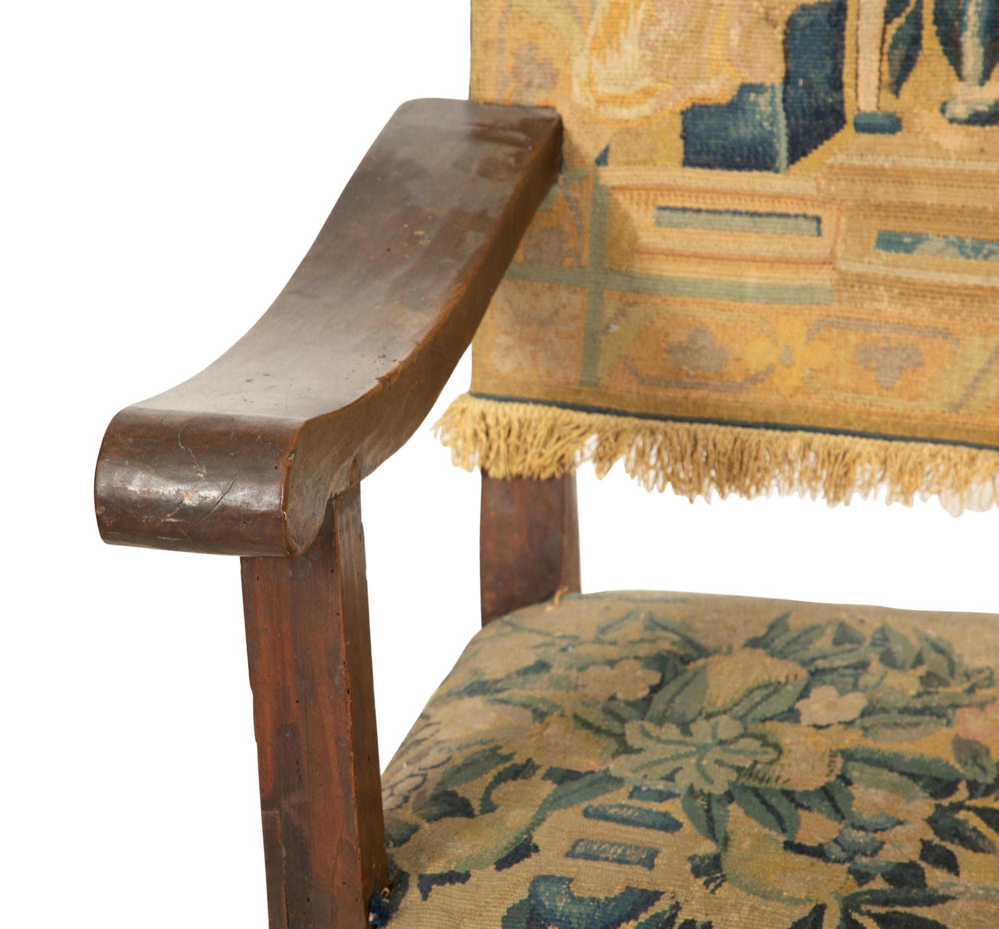 A Jacobean Style Walnut Bench with Tapestry Upholstery