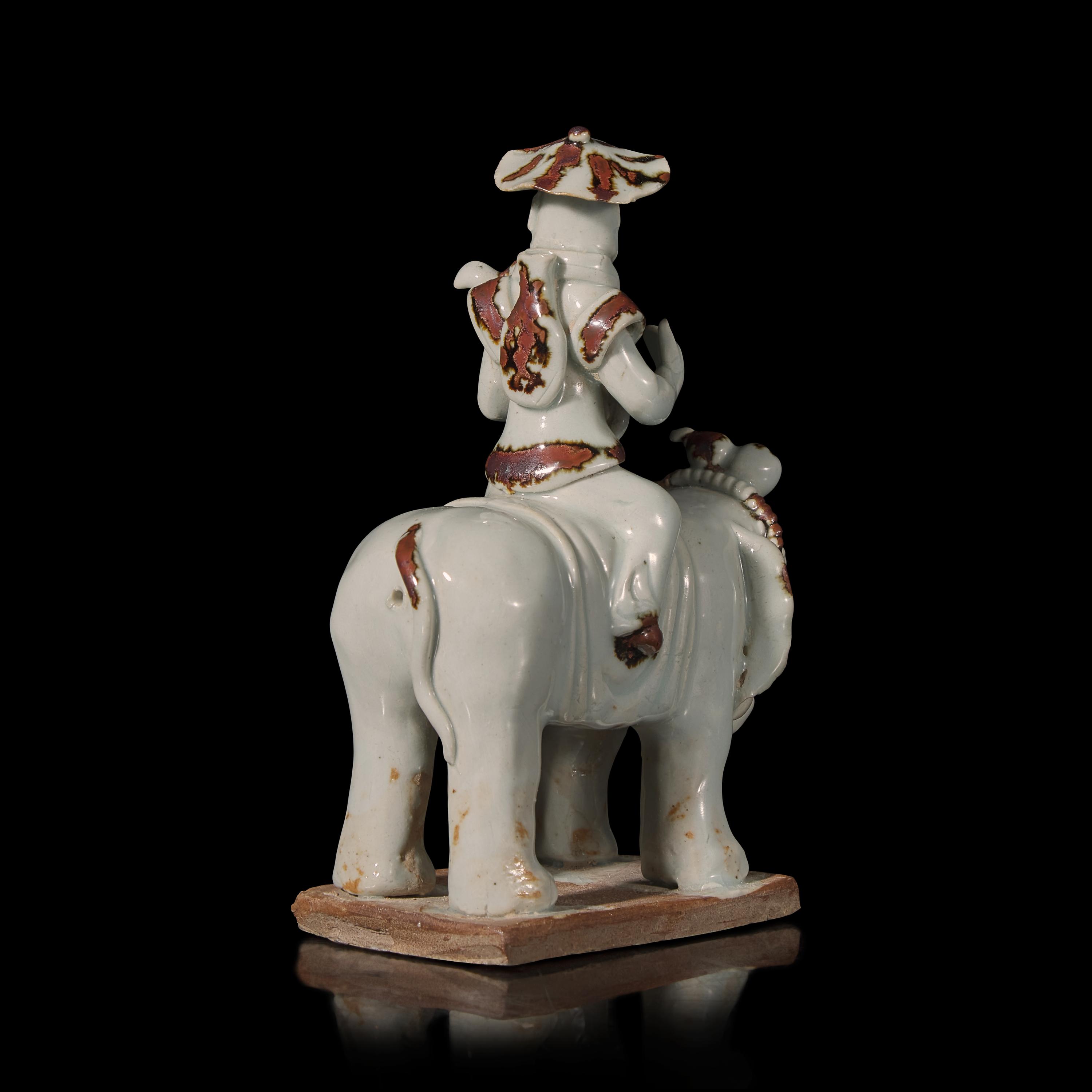 A Chinese Hutian Spotted Qingbai Glazed Porcelain Foreign Musicians Riding an Elephant — 湖田窯青白釉胡人琵琶騎象俑