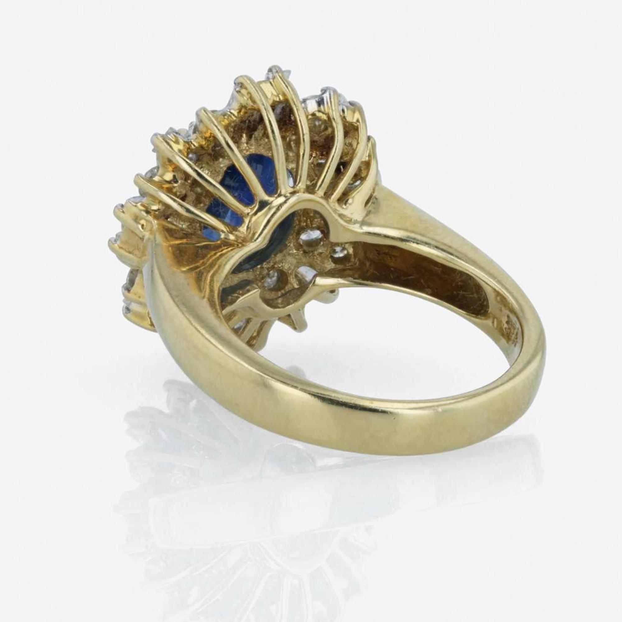 An 18K yellow gold, sapphire, and diamond ring