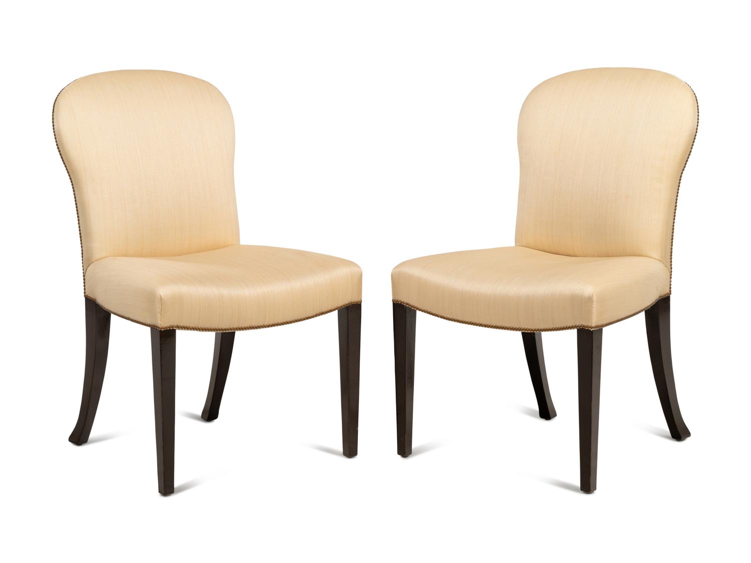 A Set of Eight Saddle Dining Chairs