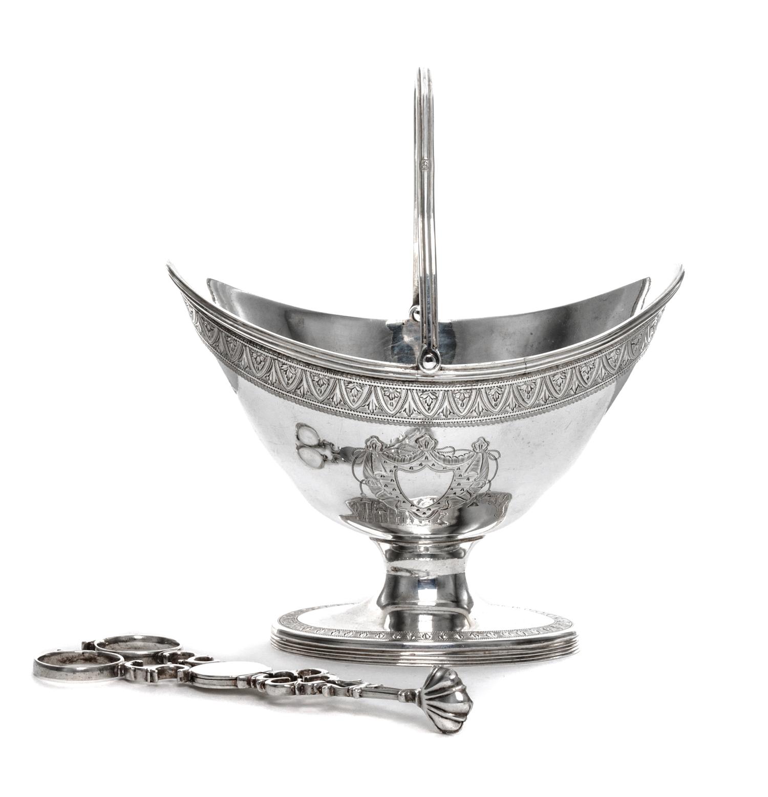 A George III Silver Sugar Basket, James Mince, London, 1791, having a swing handle, an engraved foliate band at the upper rim and ermin