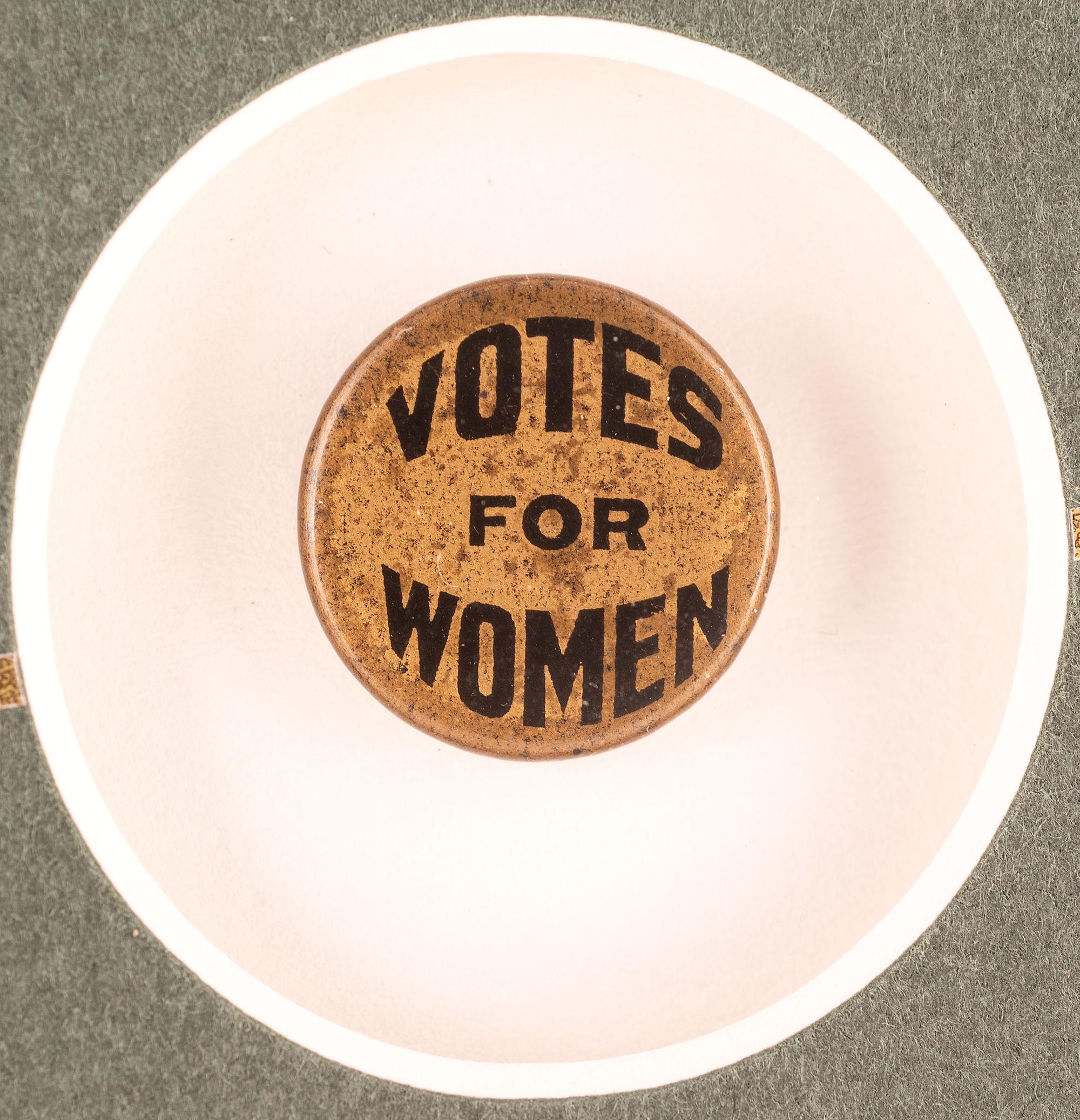 [WOMEN'S SUFFRAGE]. A collection of items belonging to women's rights activist Mariwyn Heath, incl. "Votes for Women" pennant, Veteran Feminists Medal of Honor, pinbacks, buttons, & pewter figures.