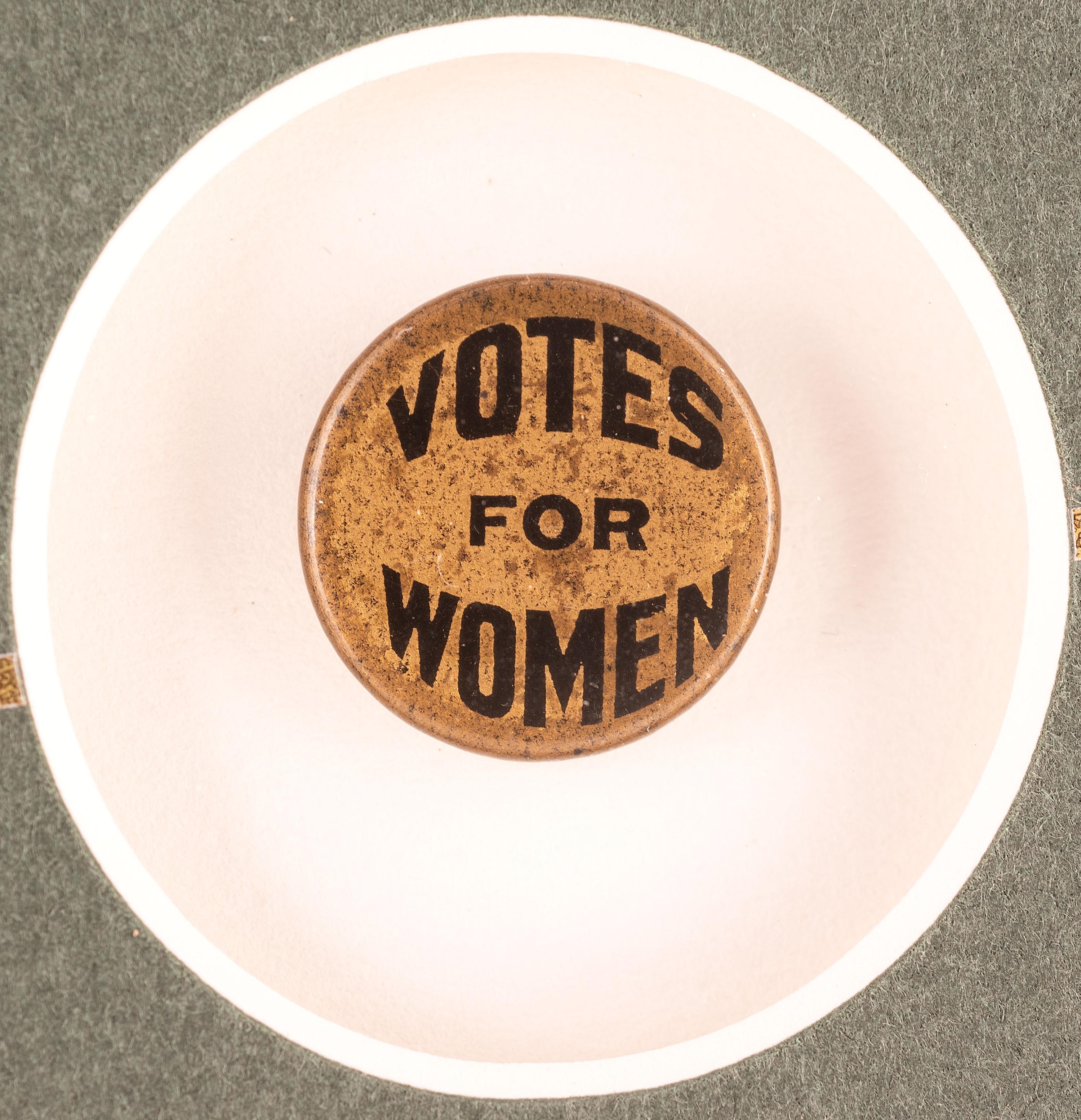 [WOMEN'S SUFFRAGE]. A collection of items belonging to women's rights activist Mariwyn Heath, incl. "Votes for Women" pennant, Veteran Feminists Medal of Honor, pinbacks, buttons, & pewter figures.