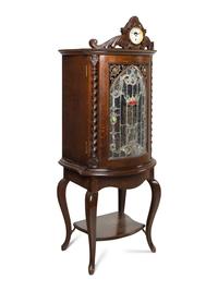 A Regina Corona 15 1/2 Inch Disk Change Music Box with Clock