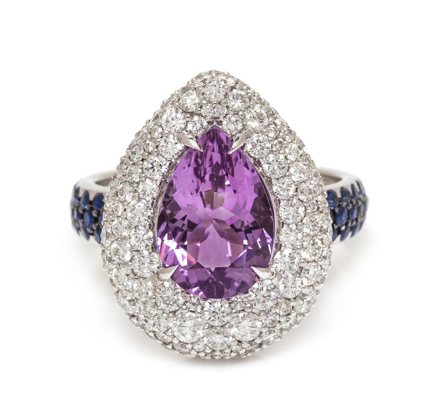 An 18 Karat White Gold, Amethyst, Diamond and Sapphire Ring, 7.40 dwts.