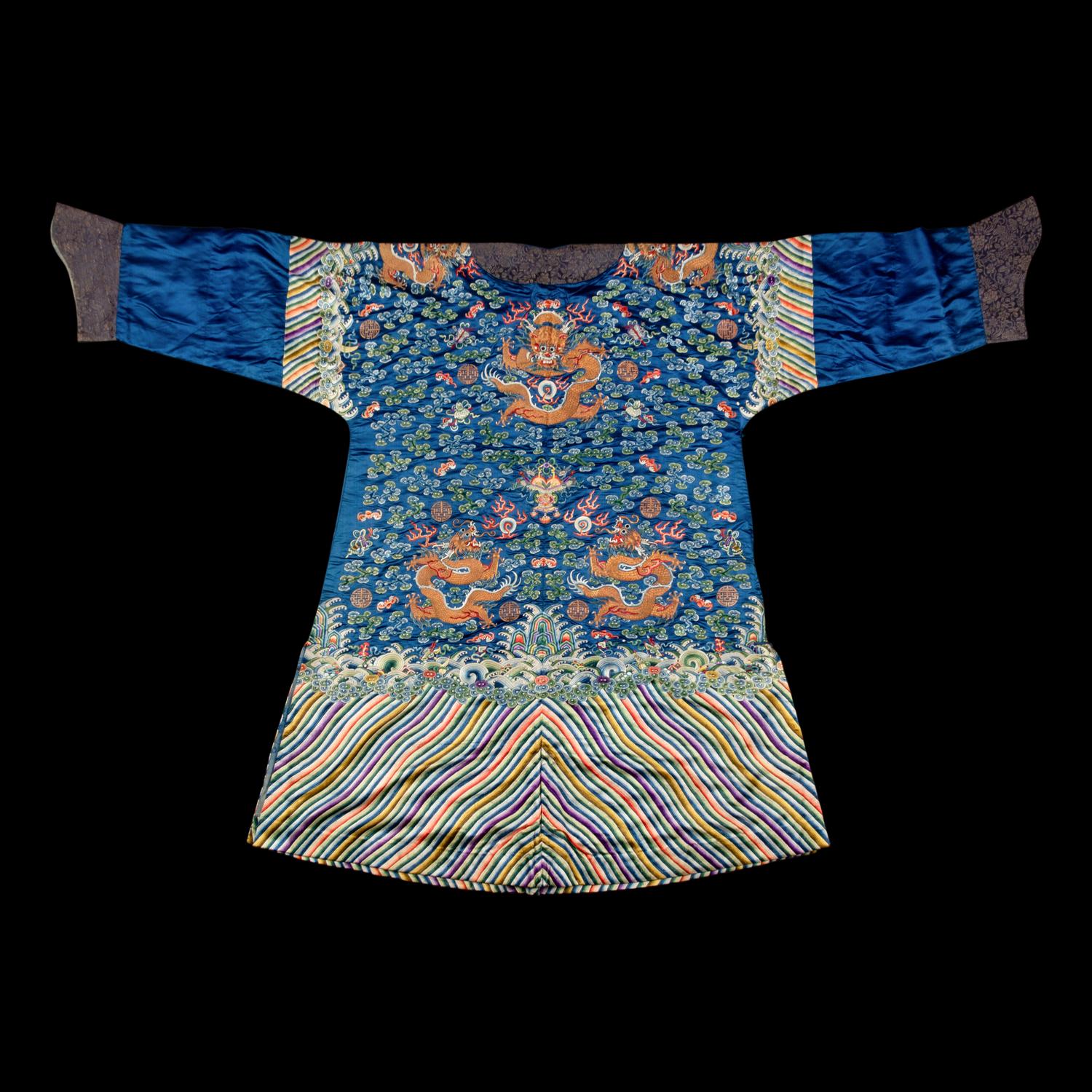 A Chinese Blue Ground Embroidered Silk 'Dragon' Robe, Jifu , 19th Century 清晚期 藍緞地綉云龍紋吉服