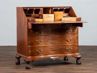 A Chippendale Carved Mahogany Reverse Serpentine Block-Front Desk