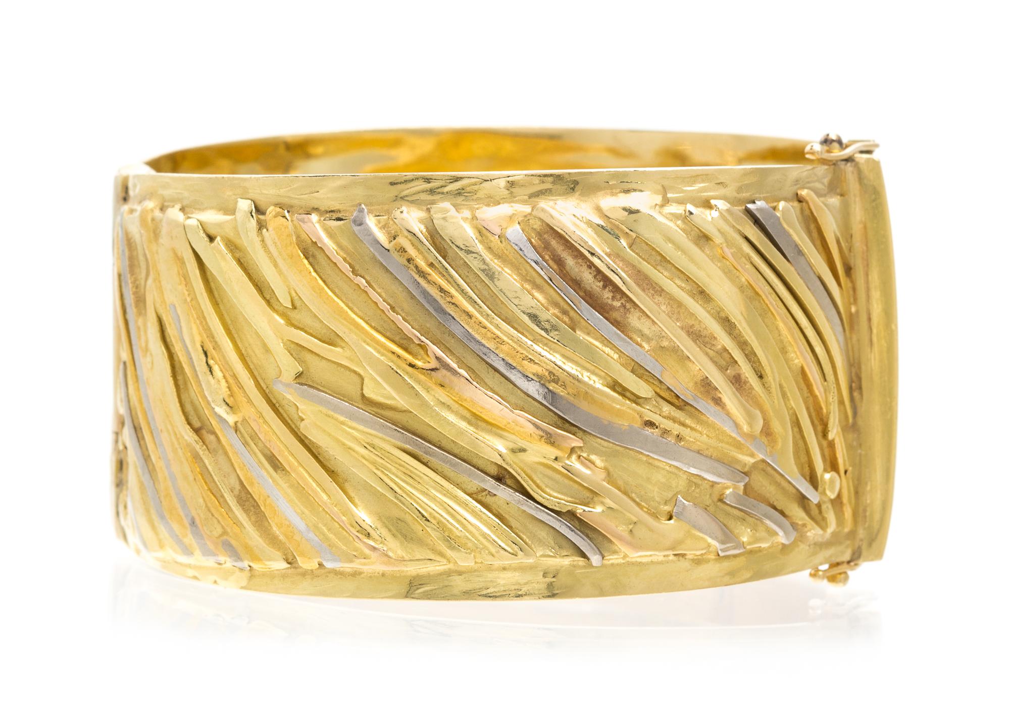 An 18 and 24 Karat Tri Color Gold Bangle Bracelet, Marne Ryan, 66.30 dwts.
