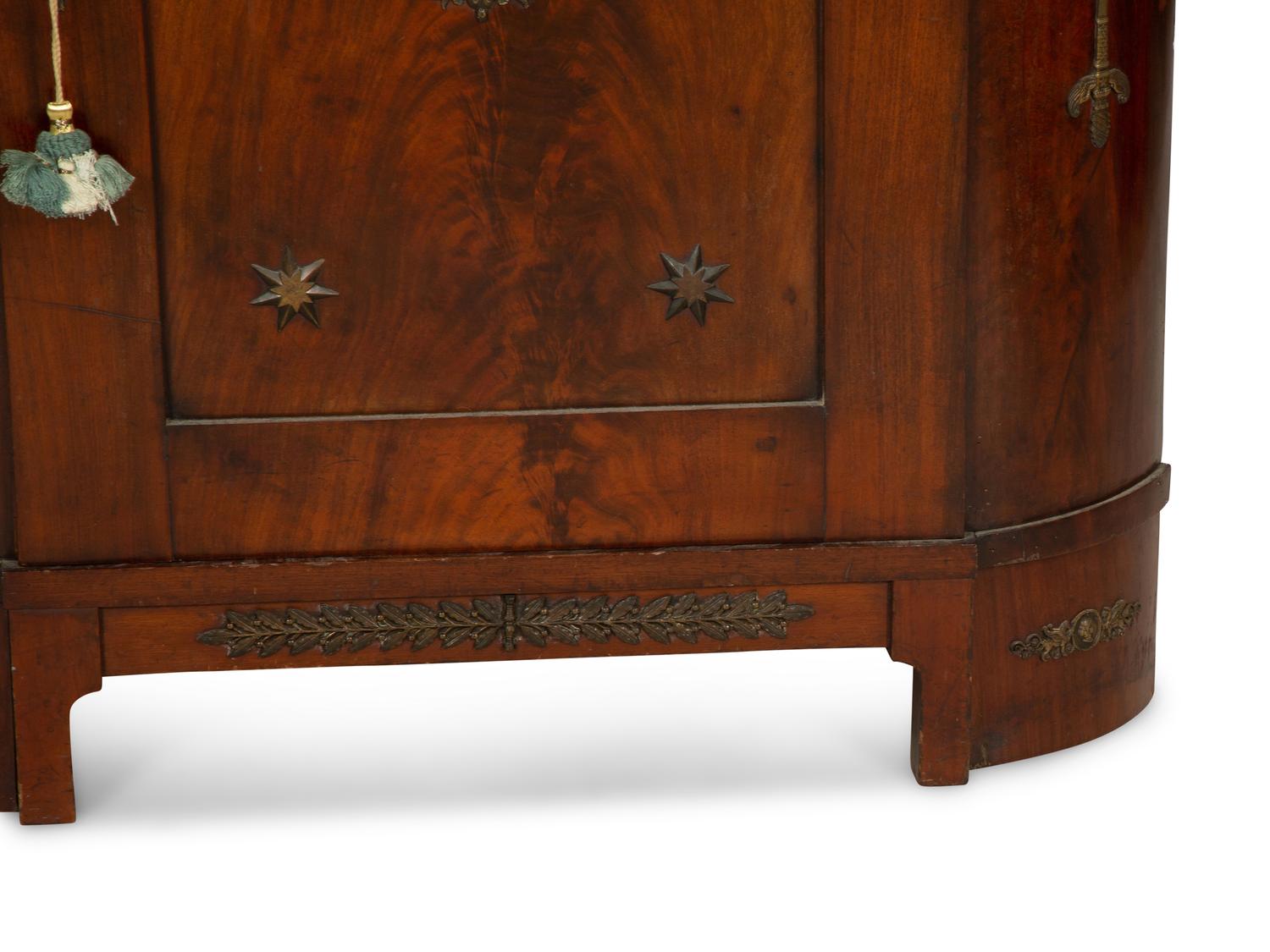 An Empire Gilt Bronze Mounted Mahogany Encoignure with a Brèche d'Alep Marble Top