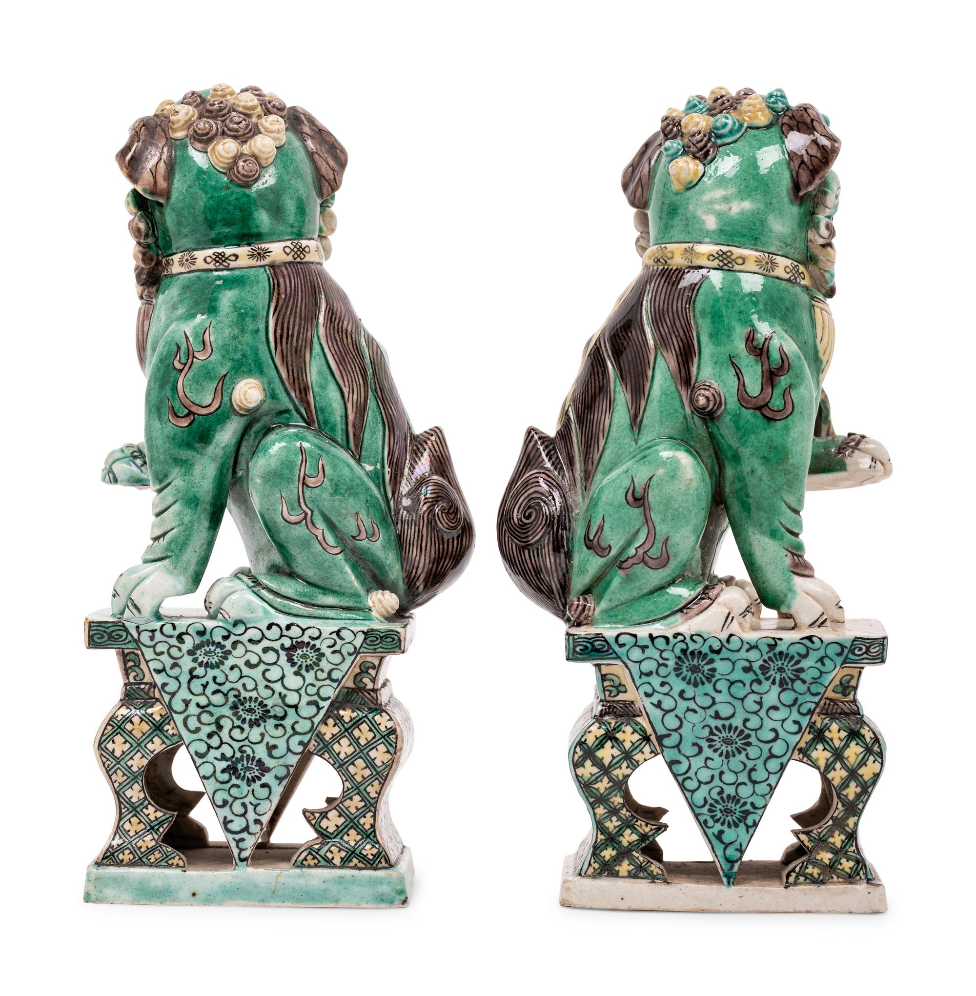 A Pair of Chinese Famille Verte Porcelain Figures of Fu Lions