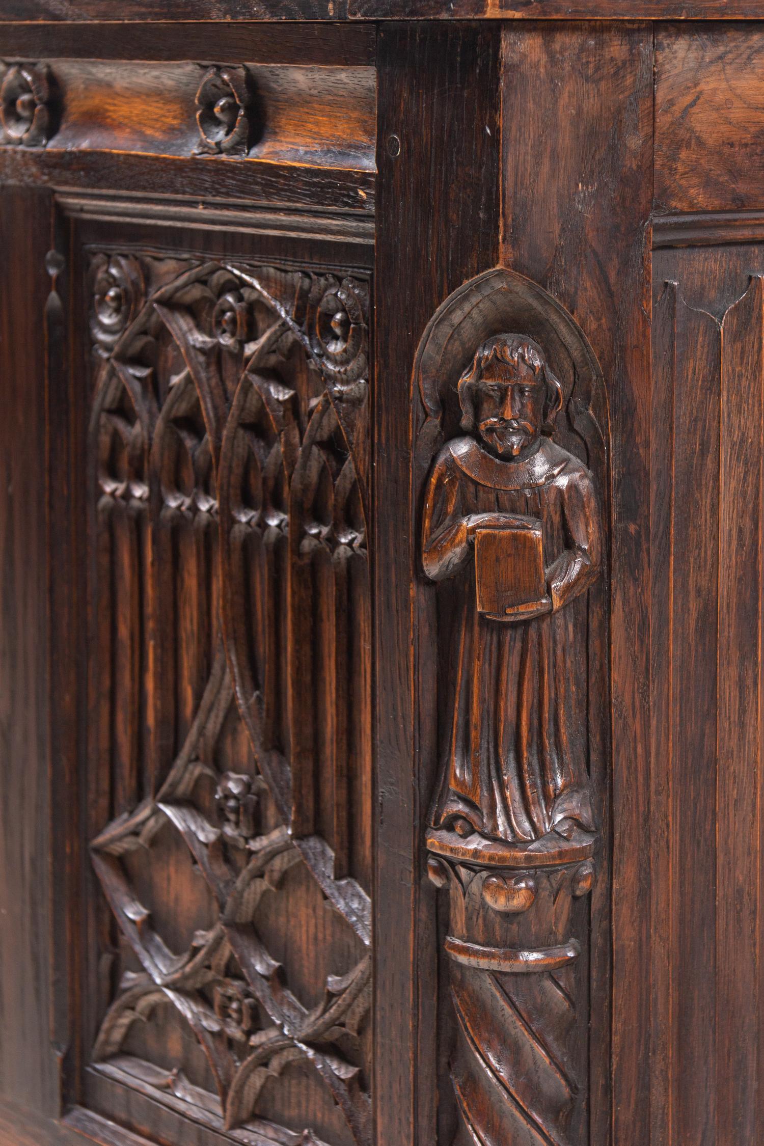 A Gothic Revival Carved Oak Chest