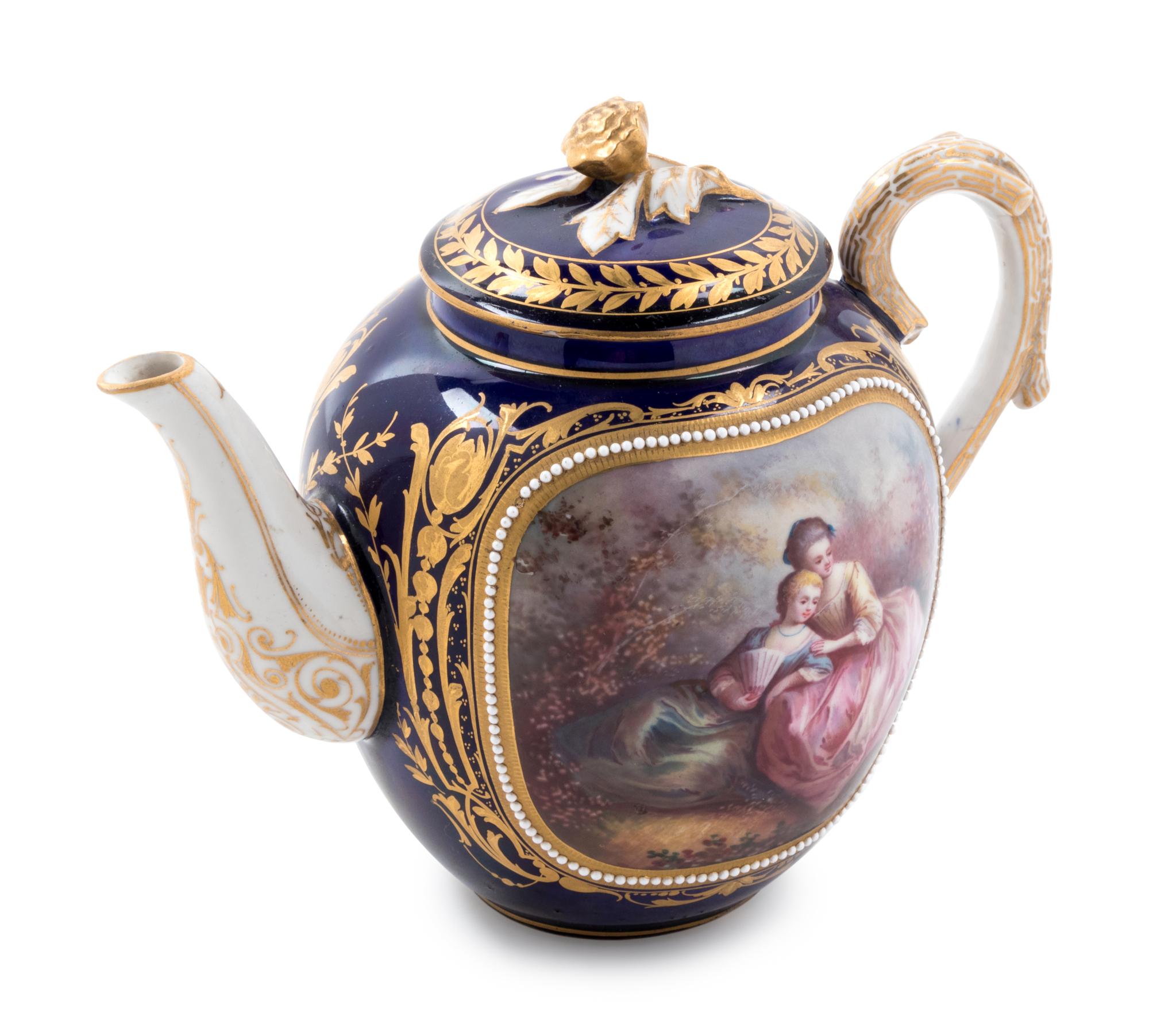 A Sèvres Style Painted, Parcel Gilt and "Jeweled" Porcelain Teapot