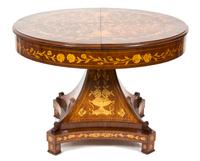 A Dutch Mahogany and Fruitwood Marquetry Center Table Height 31 1/2 x diameter 41 1/2 inches. Extension width 13 1/2 inches. — 20TH CENTURY