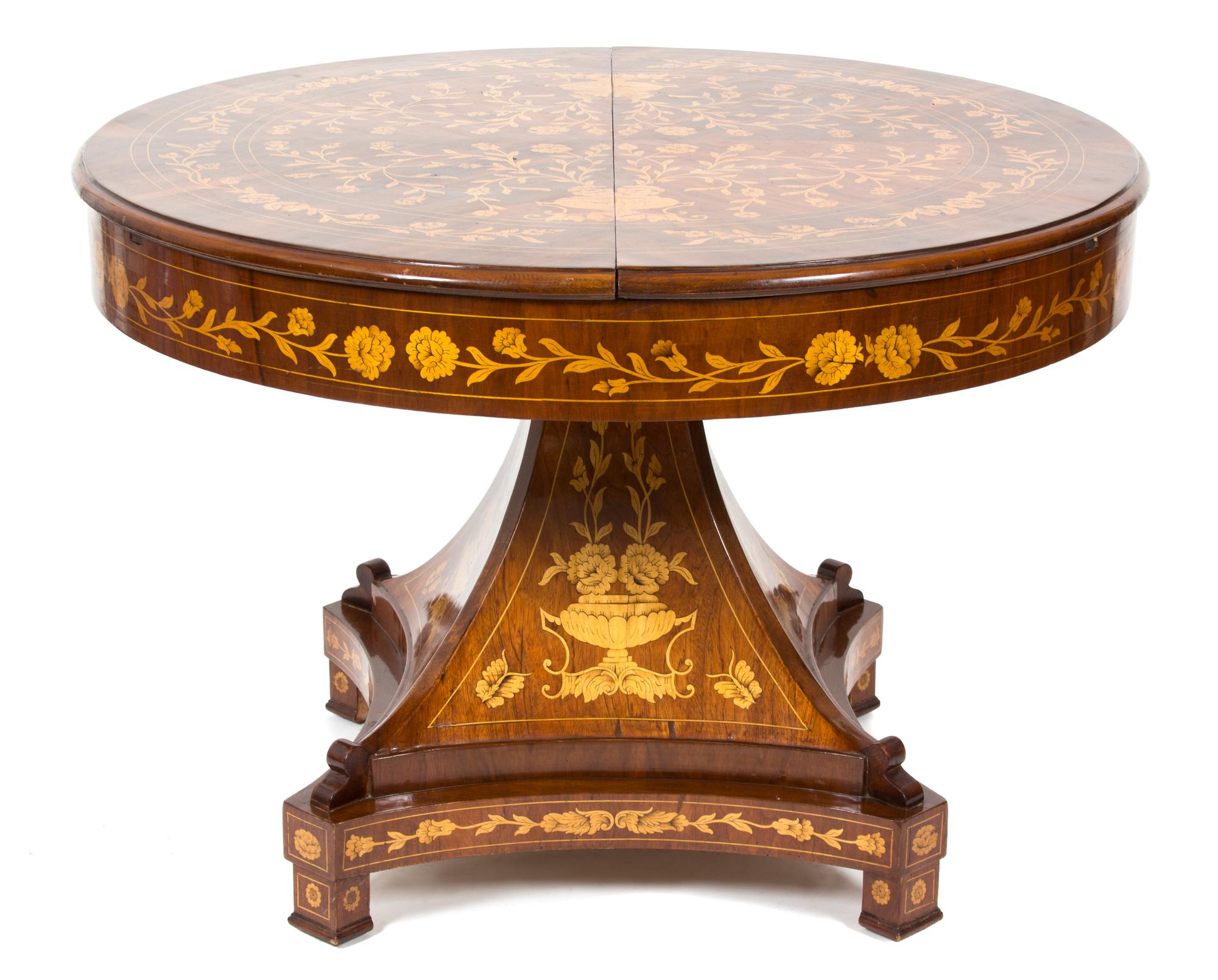 A Dutch Mahogany and Fruitwood Marquetry Center Table Height 31 1/2 x diameter 41 1/2 inches. Extension width 13 1/2 inches. — 20TH CENTURY