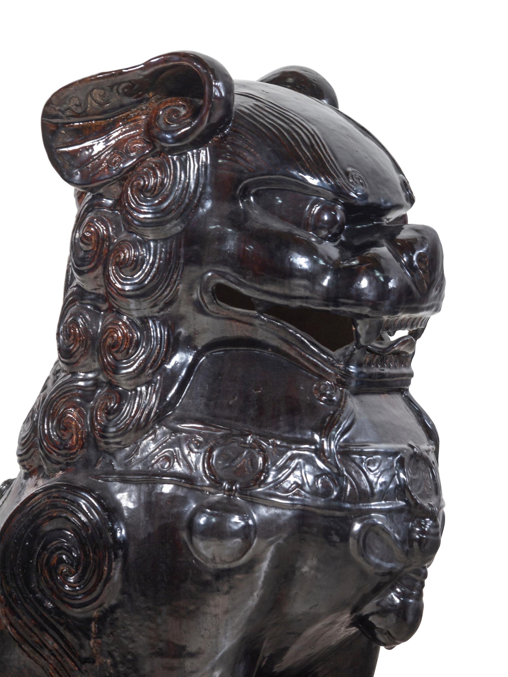 A Large Pair of Chinese Brown Glazed Stoneware Figures of Fu Lions