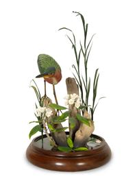 A Carved and Painted Shore Bird in Naturalistic Setting