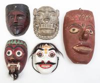 A Collection of Seven Masks Height of largest 17 inches.