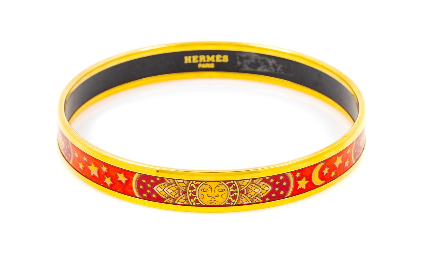 An Hermès Red and Orange Narrow Enamel 70mm Bangle, 2.75" diameter, .4" W.
