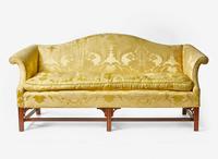 A Chippendale style mahogany camelback sofa with yellow silk damask upholstery, 20th century
