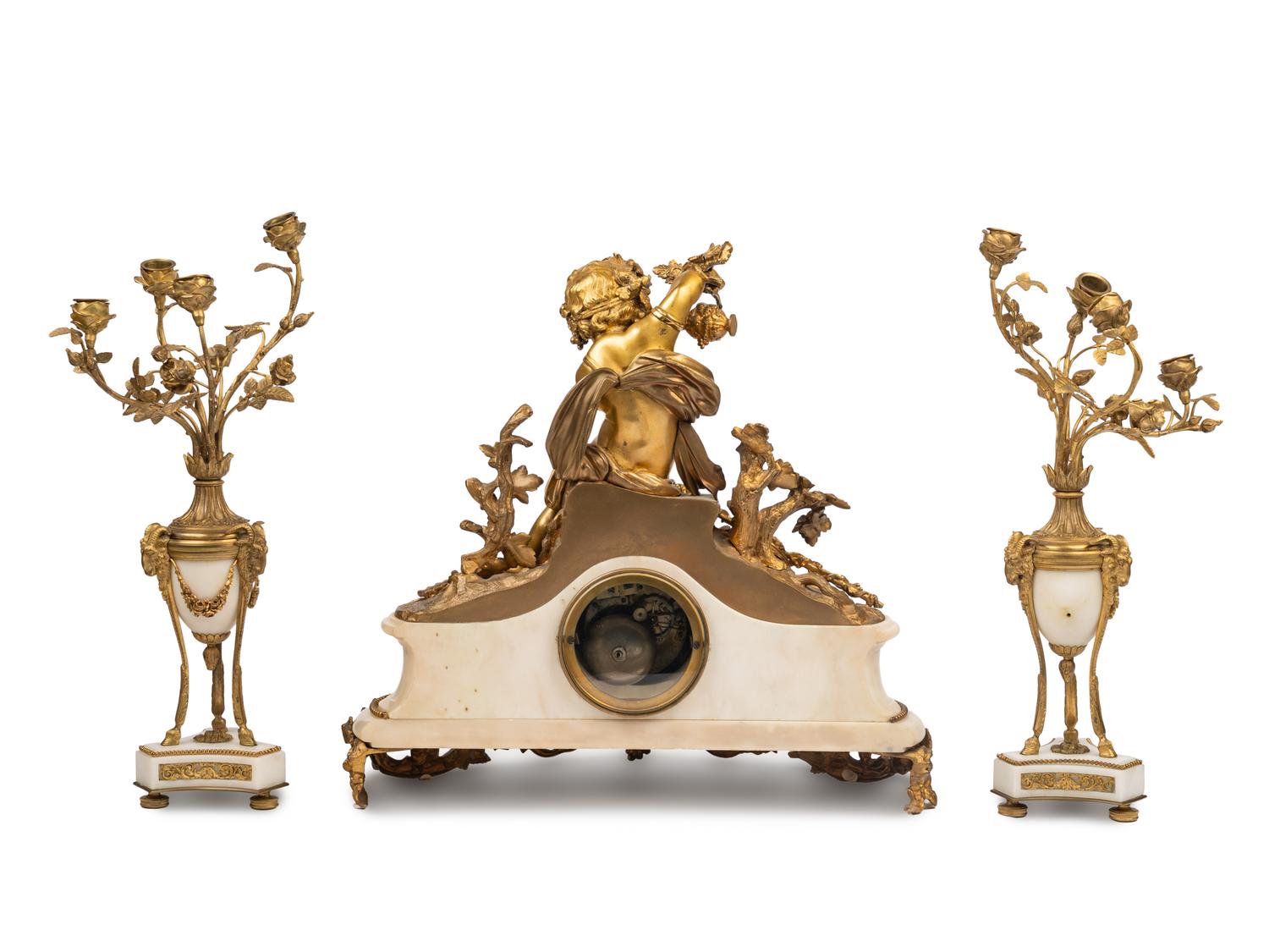 An Assembled French Gilt Bronze Mounted Marble Three-Piece Clock Garniture