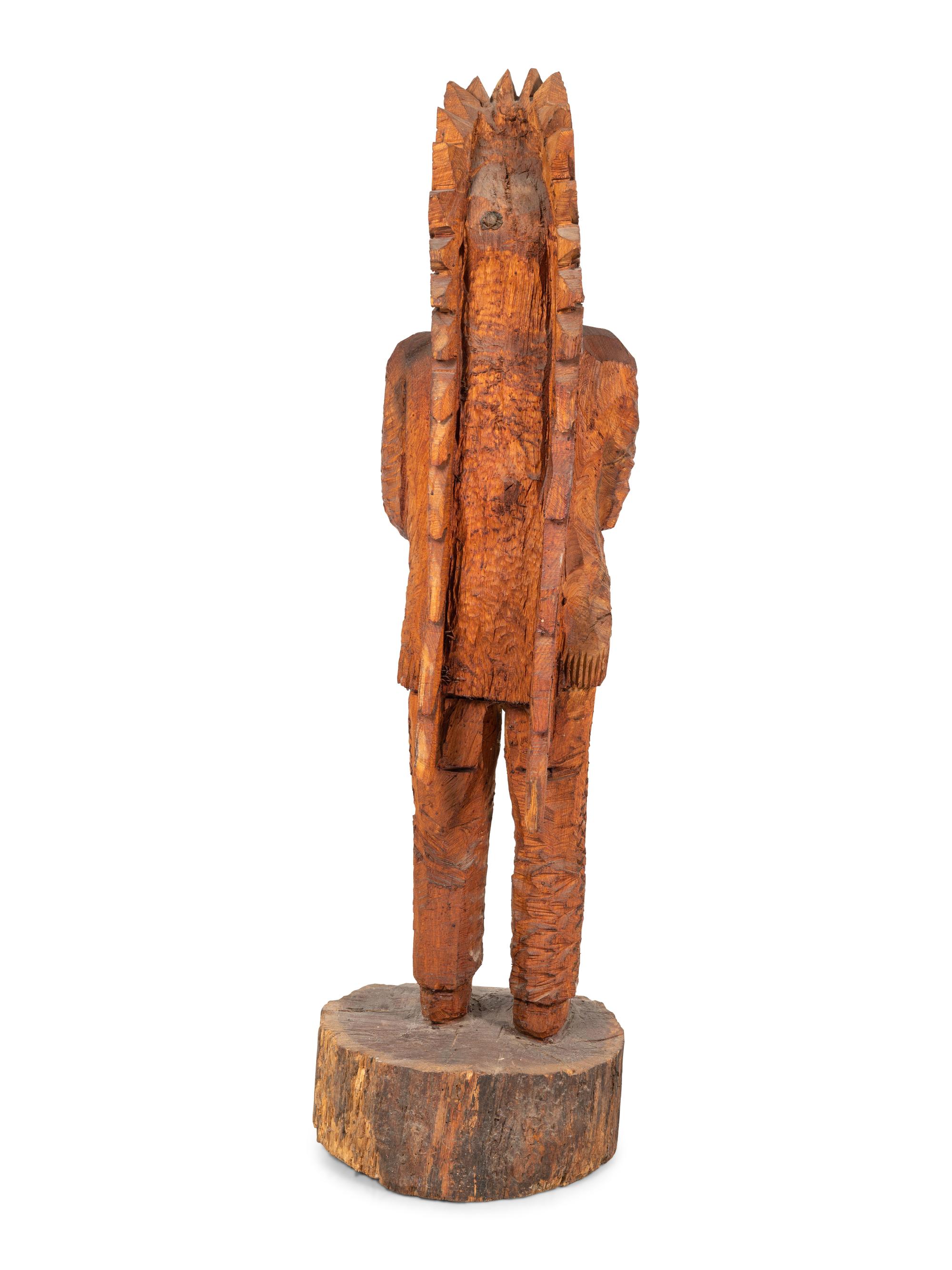 A Carved Wood Figure of an Indian by Don Colp (American, b. 1932)