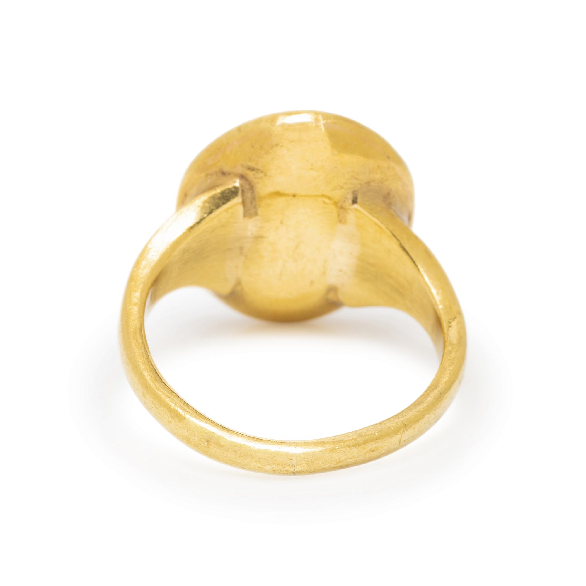 ATTILIO CODOGNATO, YELLOW GOLD AND GARNET INTAGLIO RING