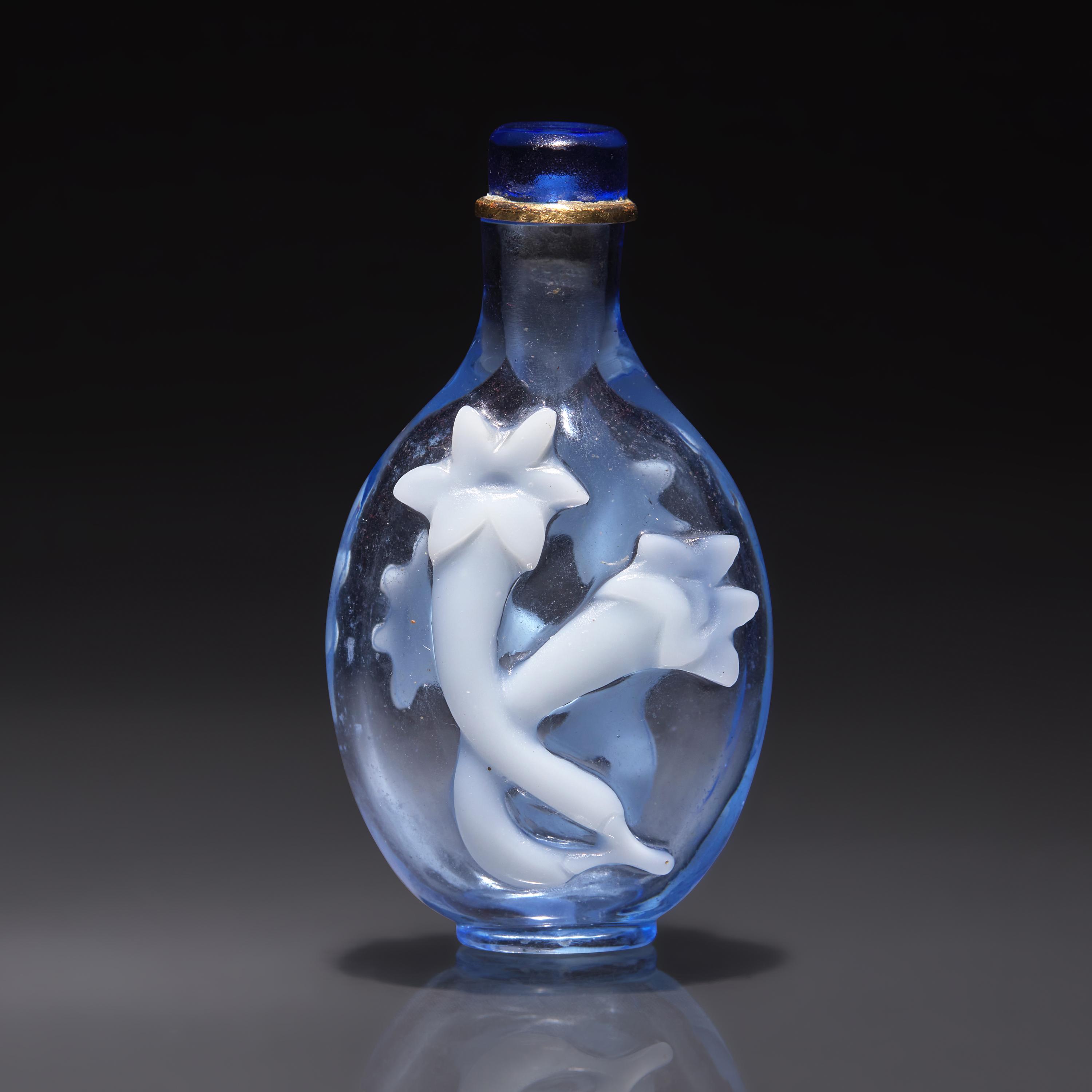 An Imperial Chinese Overlay Glass Snuff Bottle, Qing Dynasty, 18th Century — 清中期 御製淡藍地套白料龍膽花鼻煙壺