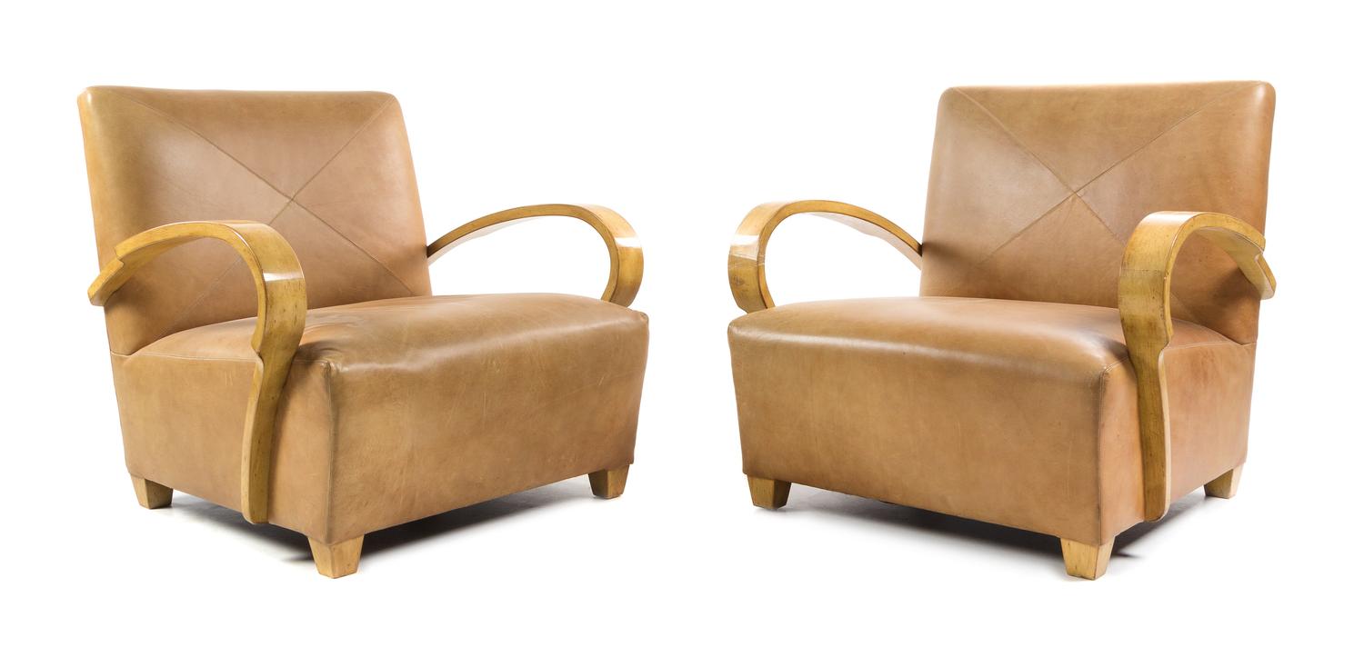 A Pair of American Maple and Leather Lounge Chairs, Height 30 inches