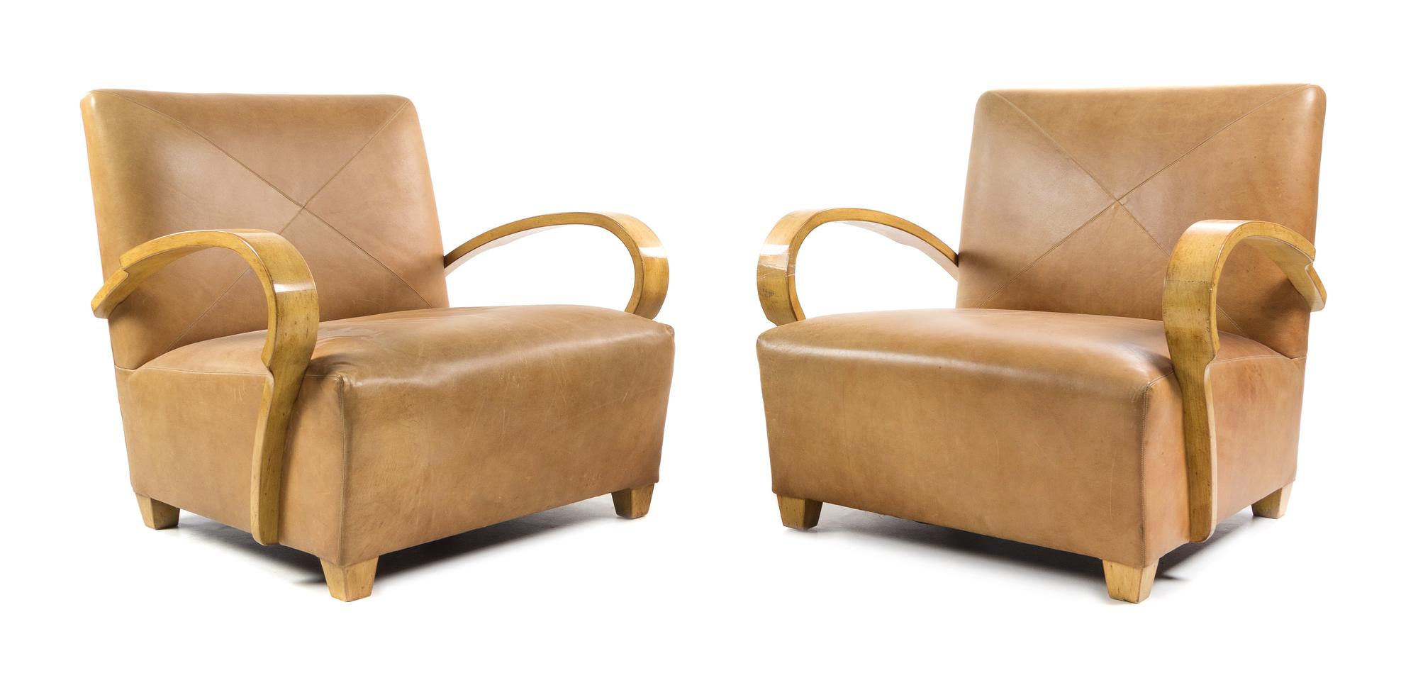 A Pair of American Maple and Leather Lounge Chairs, Height 30 inches