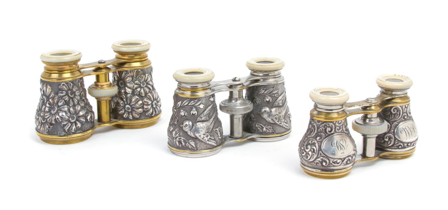 Three Pairs of French Silver and Silvered Opera Glasses, Width of widest 4 1/4 inches.