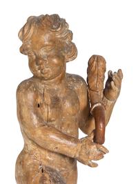 A Pair of Florentine Carved Walnut Figures of Putti on Plinths