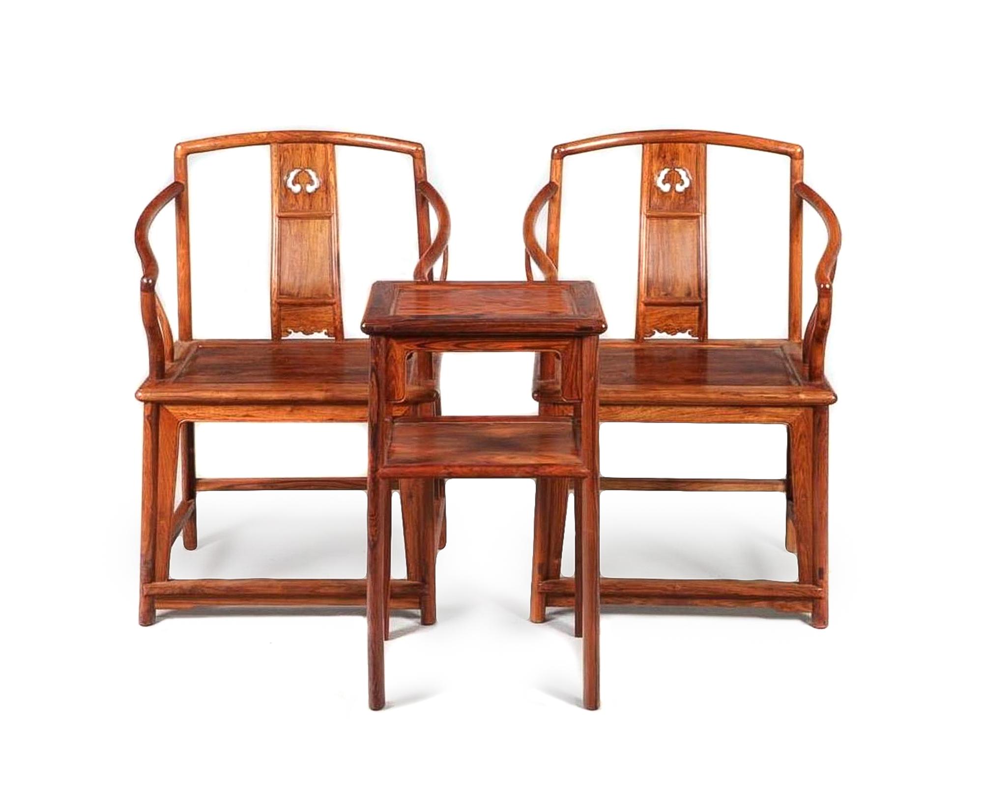 A Set of Huanghuali Armchairs and Side Table