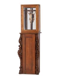 A Spanish Colonial Carved and Painted Wood Crucifix