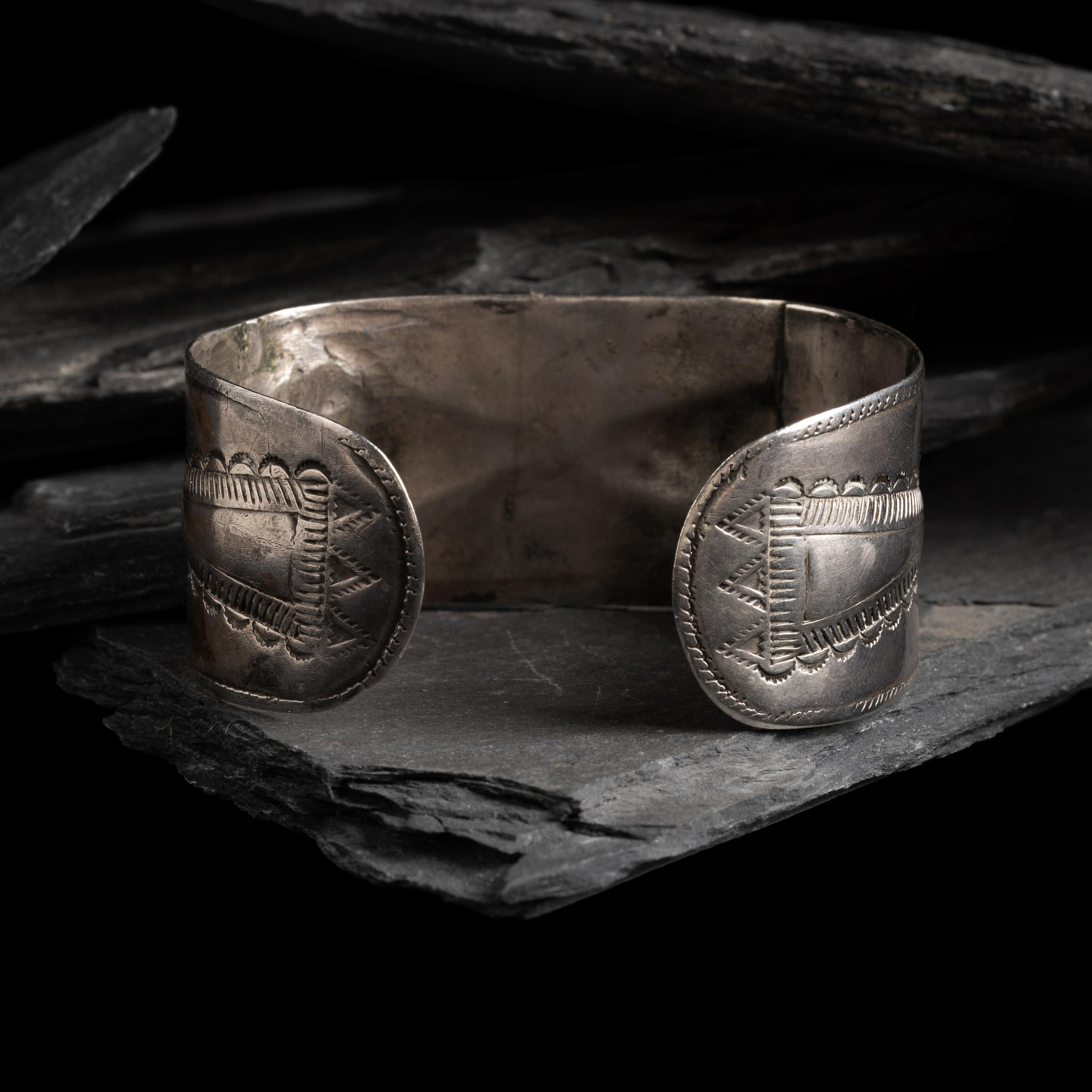 Early Navajo Heavily Stamped and Chiseled Ingot Cuff Bracelet, with Repoussé Elements