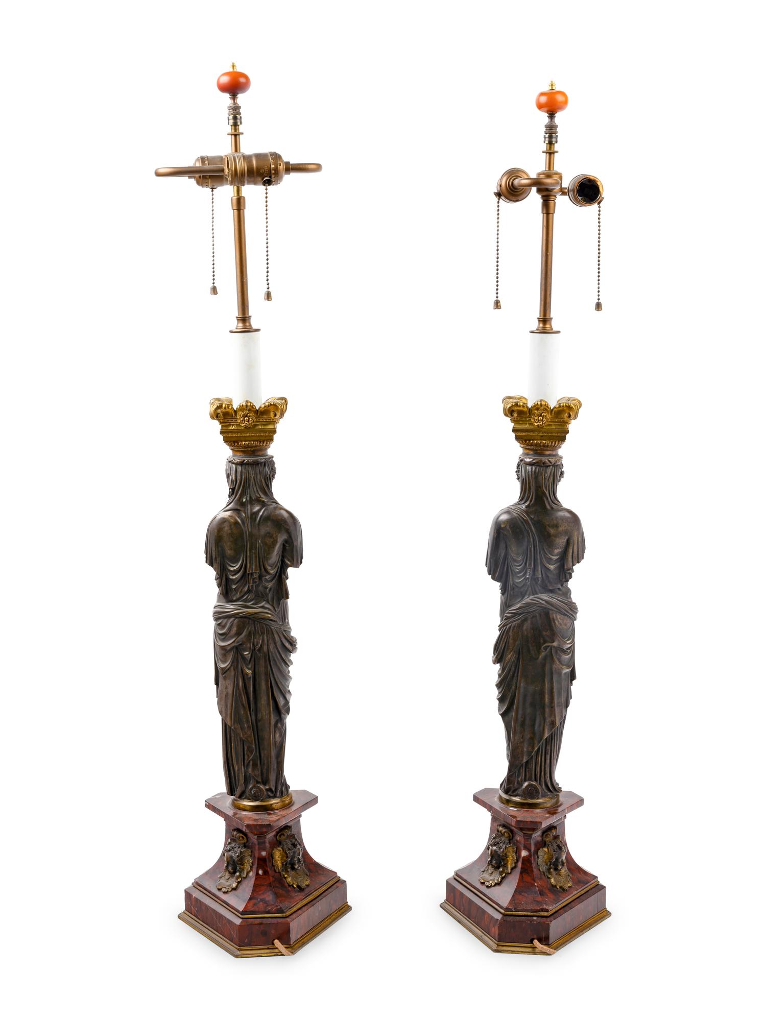 A Pair of French Neoclassical Gilt and Patinated Bronze Figural Lamps After Jean Goujon