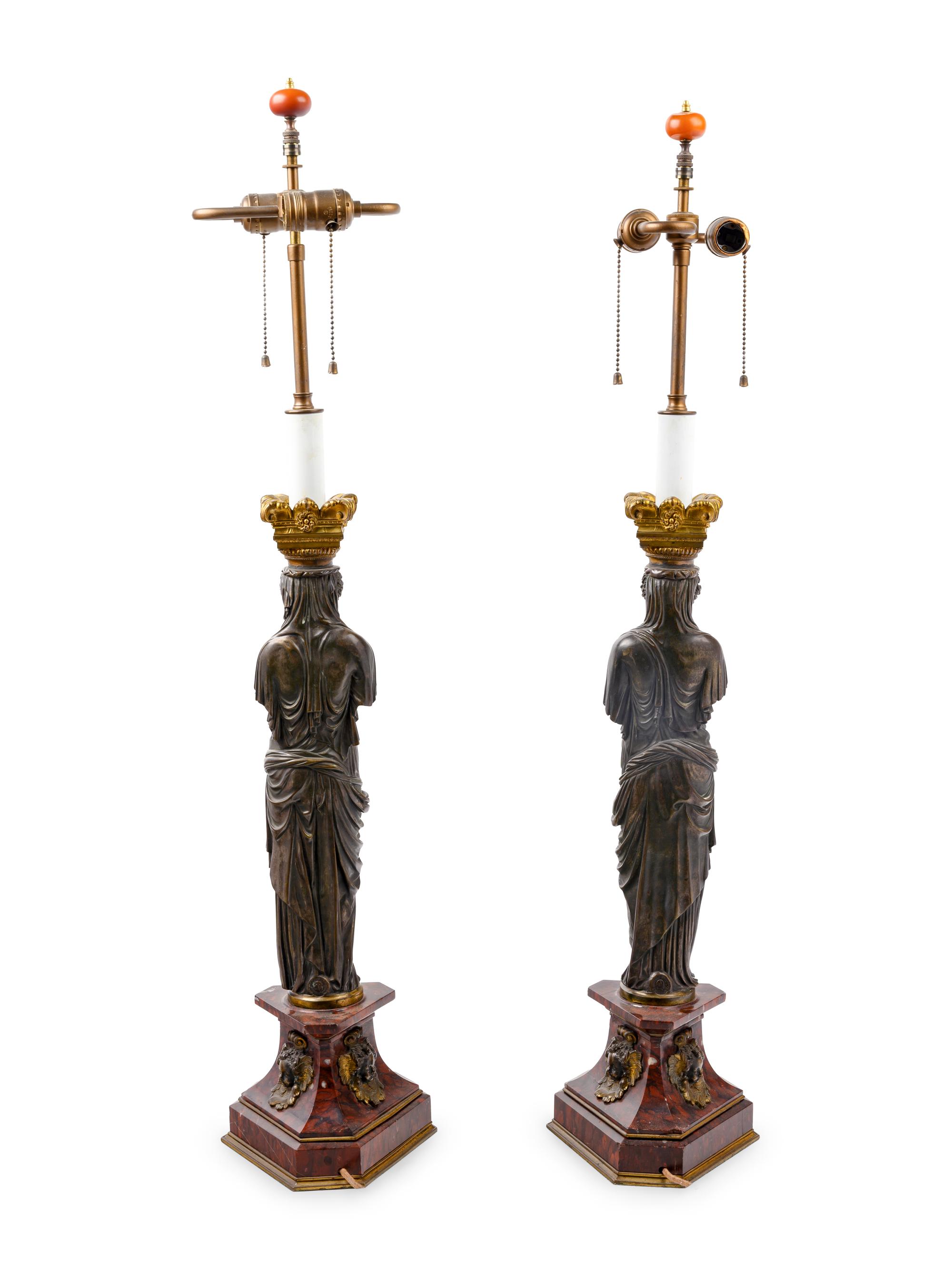 A Pair of French Neoclassical Gilt and Patinated Bronze Figural Lamps After Jean Goujon