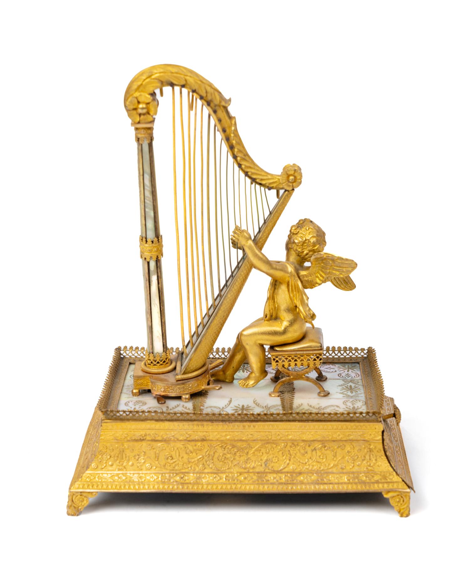 A Palais Royal Gilt Musical Ring Stand