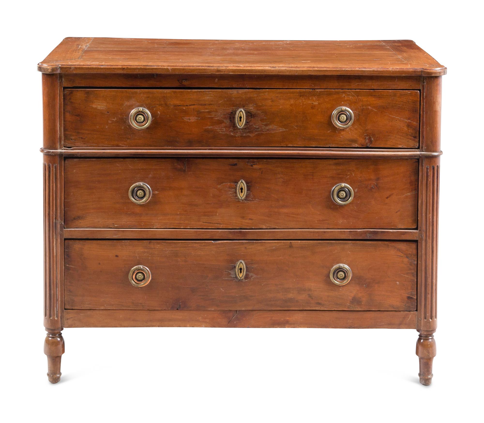 A Louis XVI Style Walnut Commode