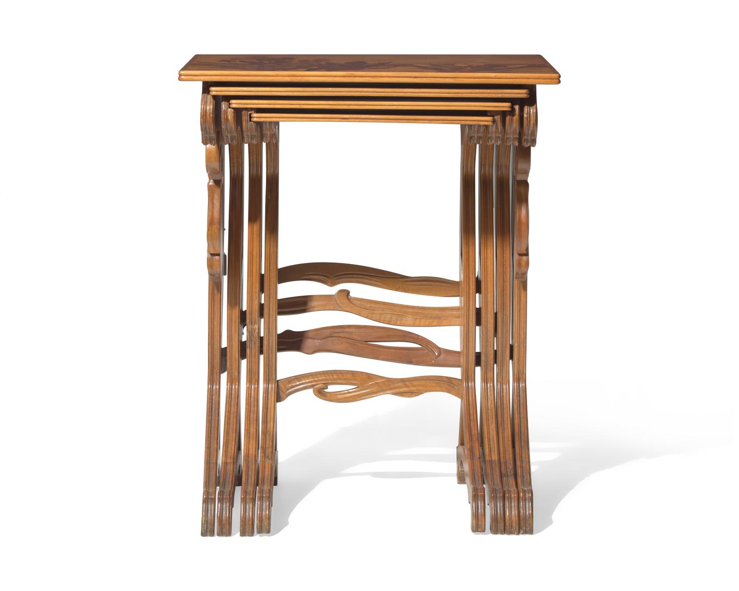 Émile Gallé (French, 1846-1904), A group of four Art Nouveau carved mahogany and marquetry nesting tables, circa 1900