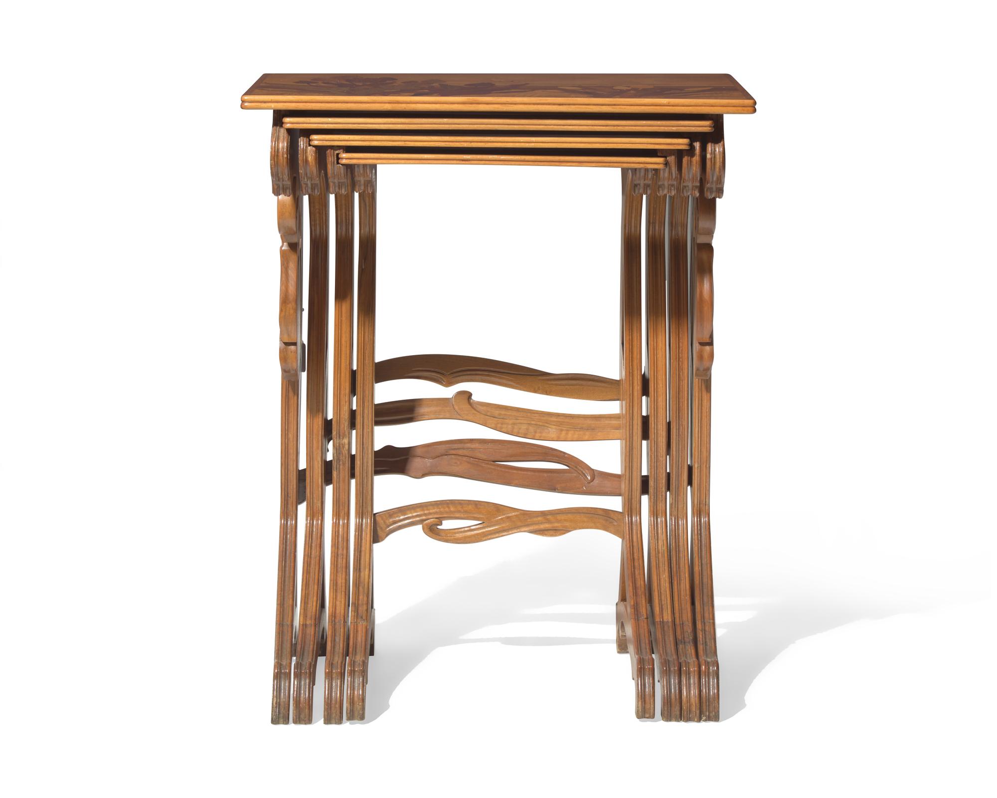 Émile Gallé (French, 1846-1904), A group of four Art Nouveau carved mahogany and marquetry nesting tables, circa 1900