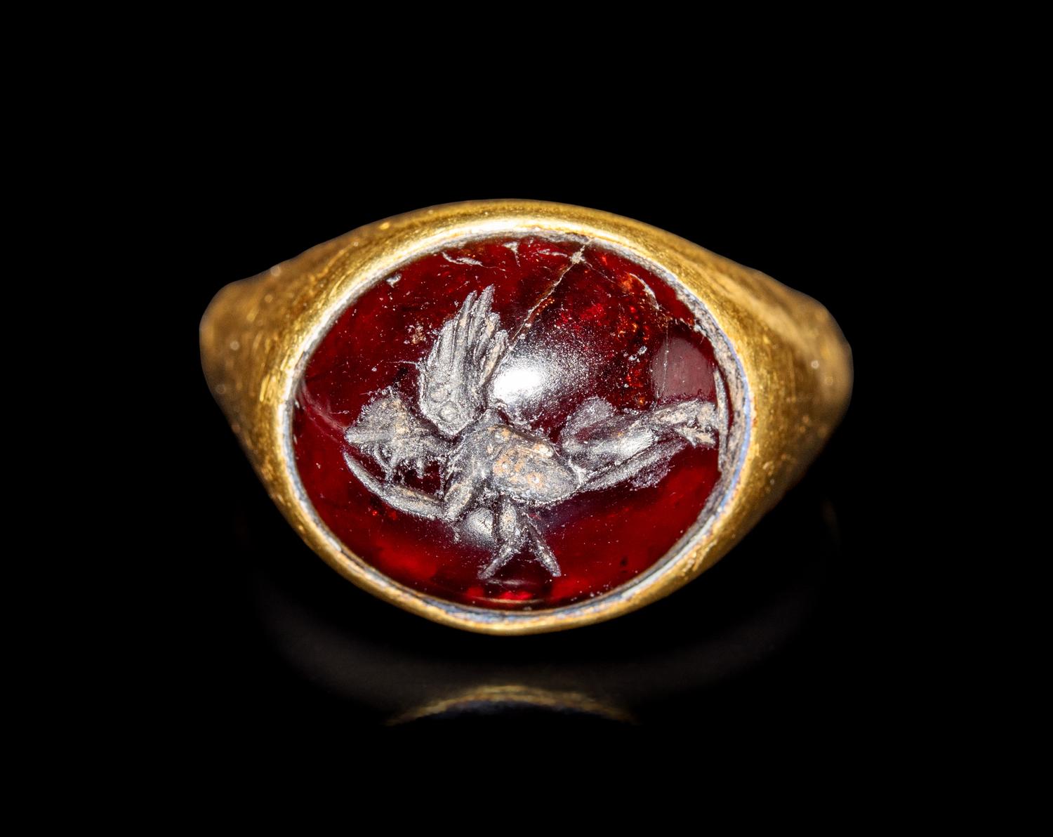 A Hellenistic Gold and Garnet Finger Ring with the God Eros