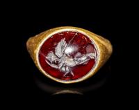 A Hellenistic Gold and Garnet Finger Ring with the God Eros