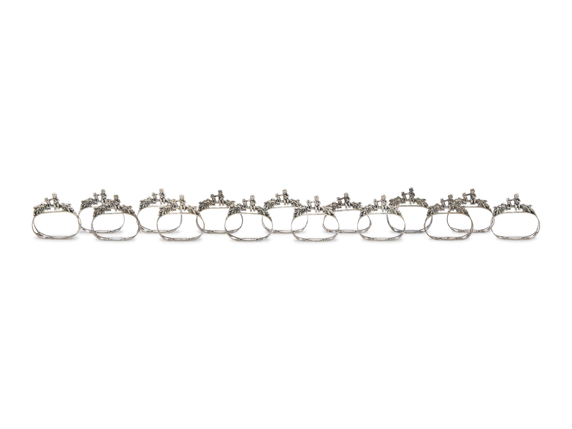 A Set of Fifteen German Silver Napkin Rings