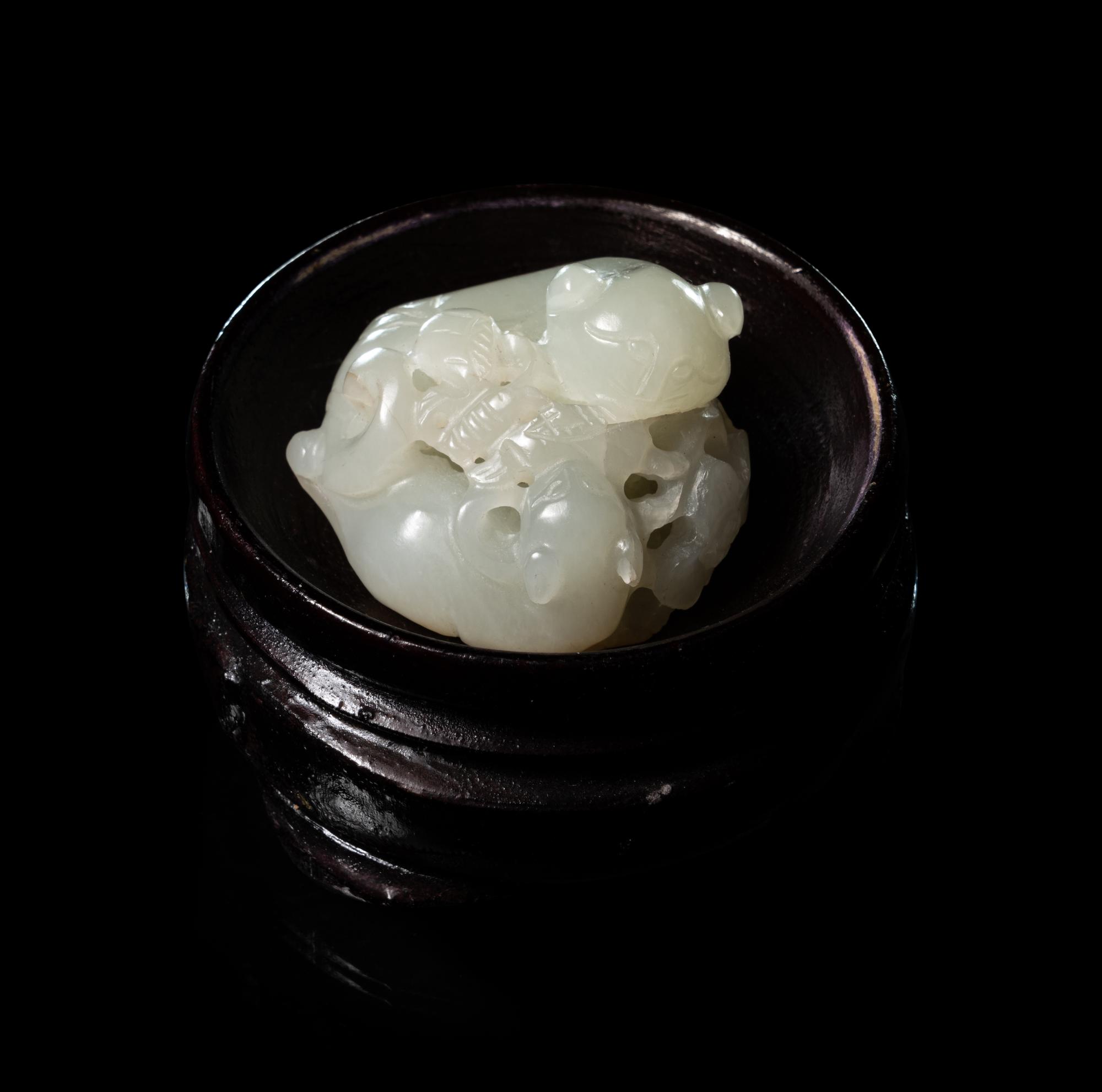 A Carved White Jade 'Double Badgers' Group
