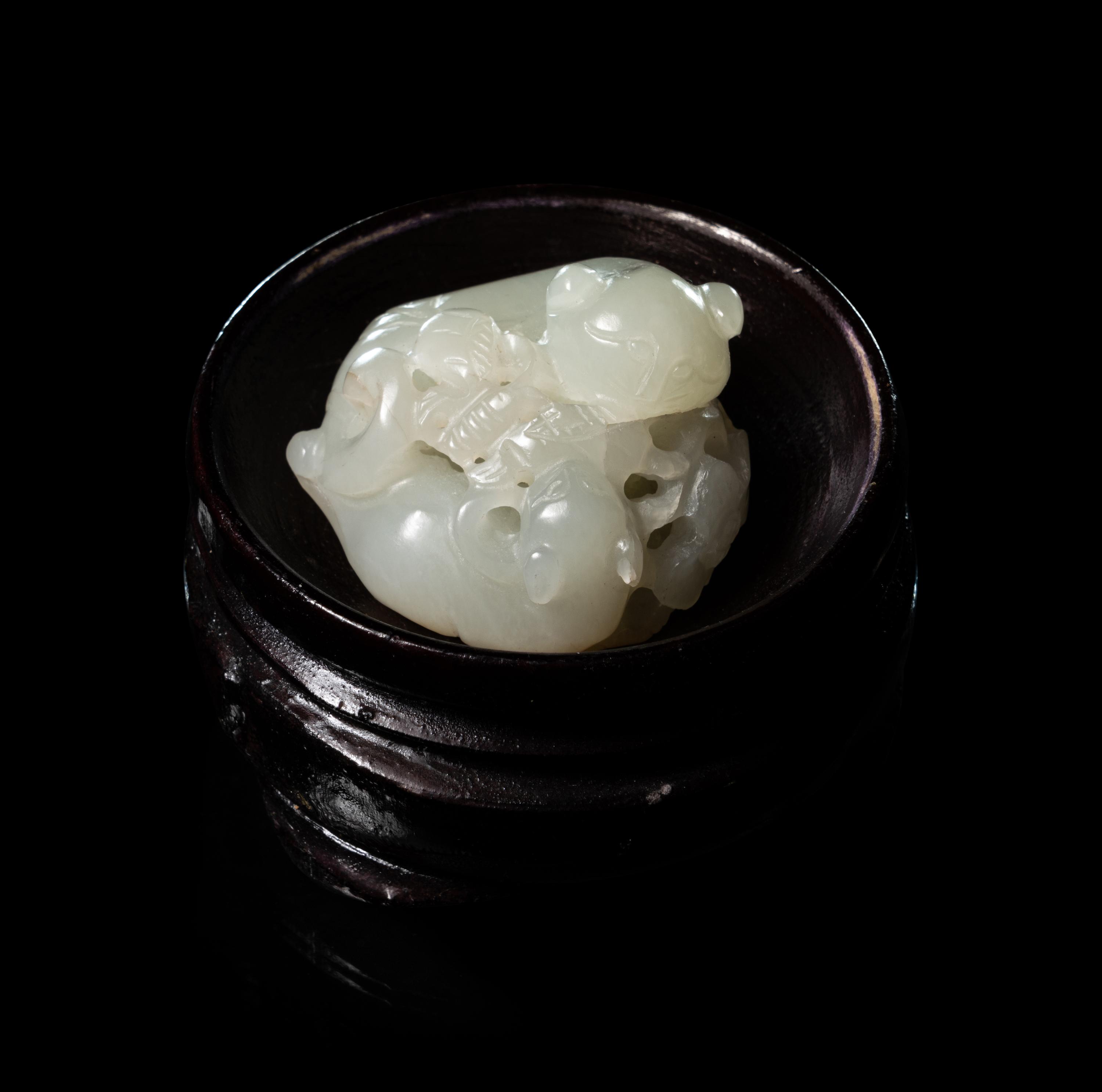 A Carved White Jade 'Double Badgers' Group