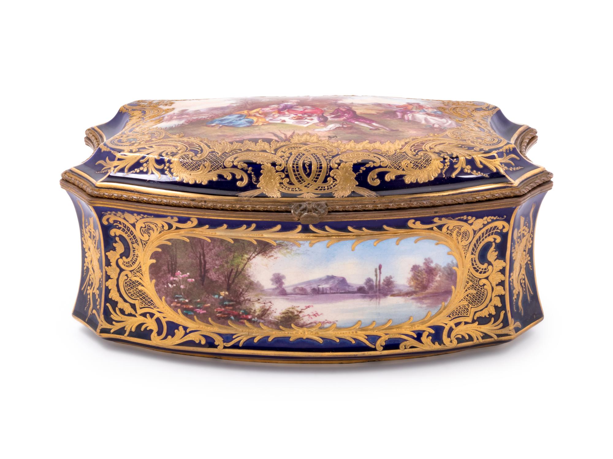 A Sèvres Style Painted and Parcel Gilt Porcelain Table Casket