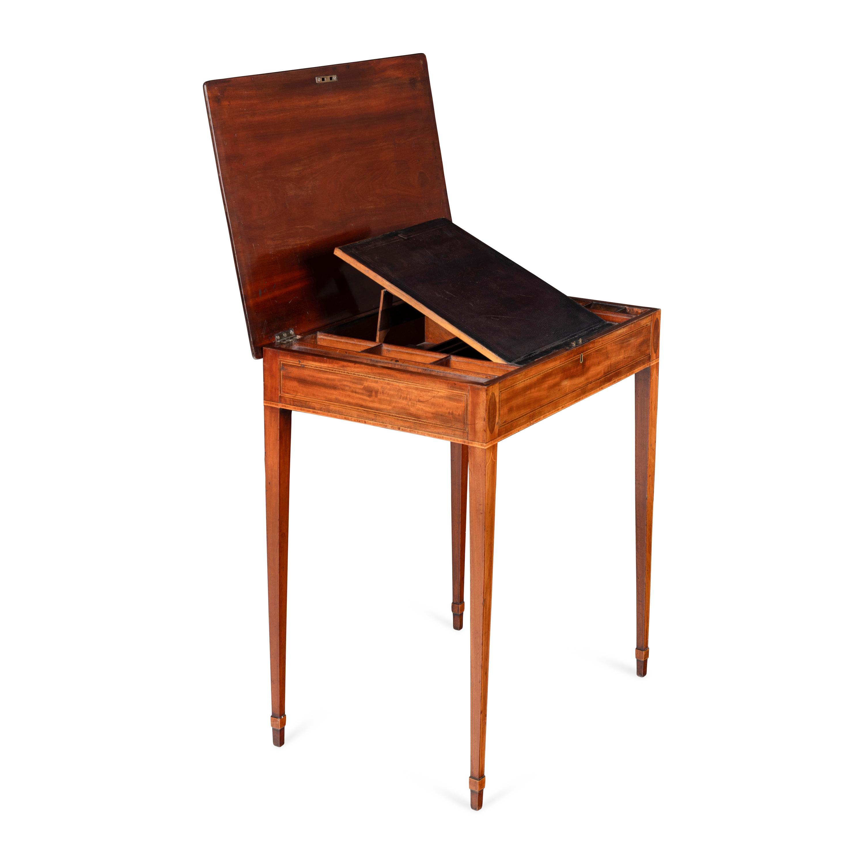 A George III Mahogany Lift-Top Writing Table